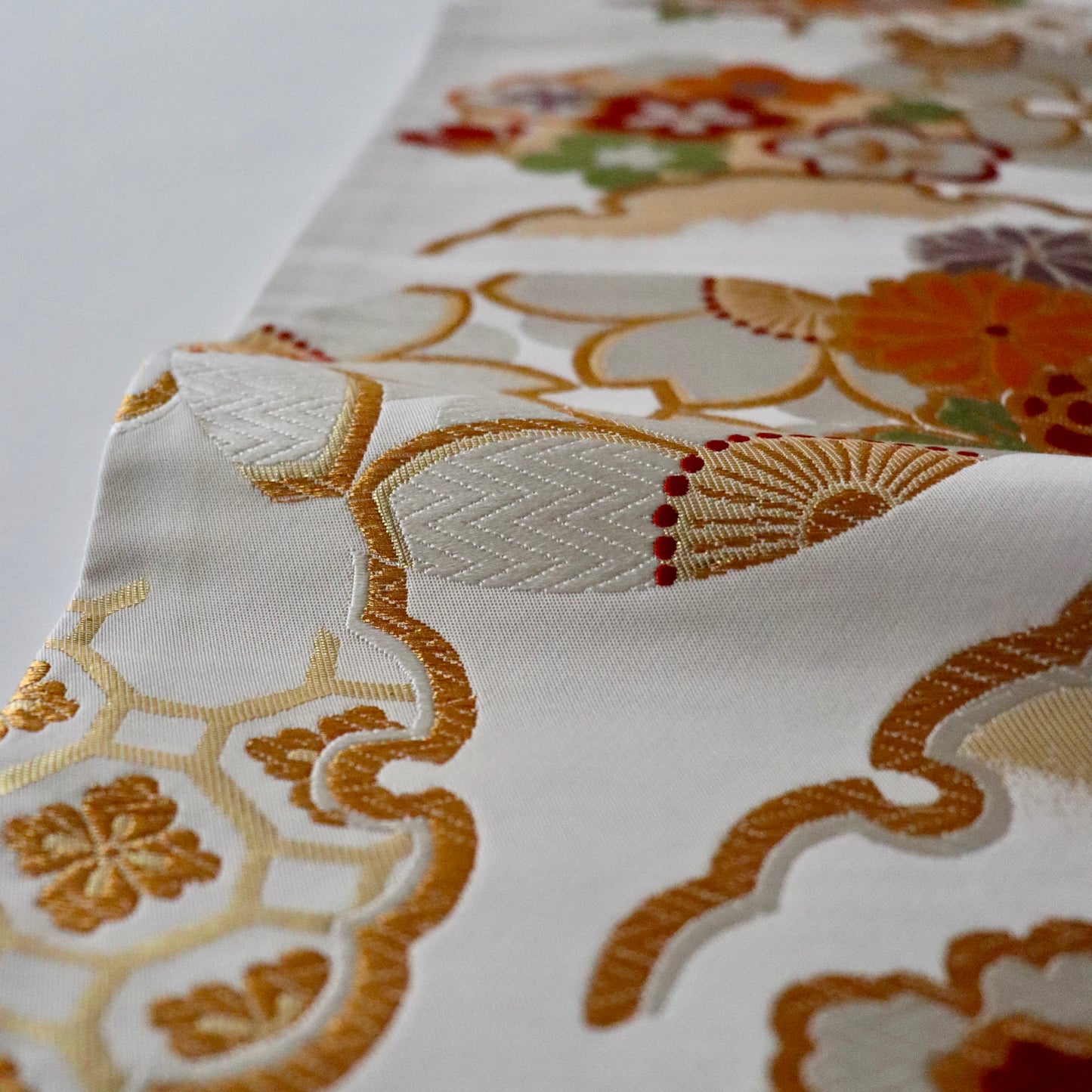 袋帯「花丸文に雪輪」岡文織物