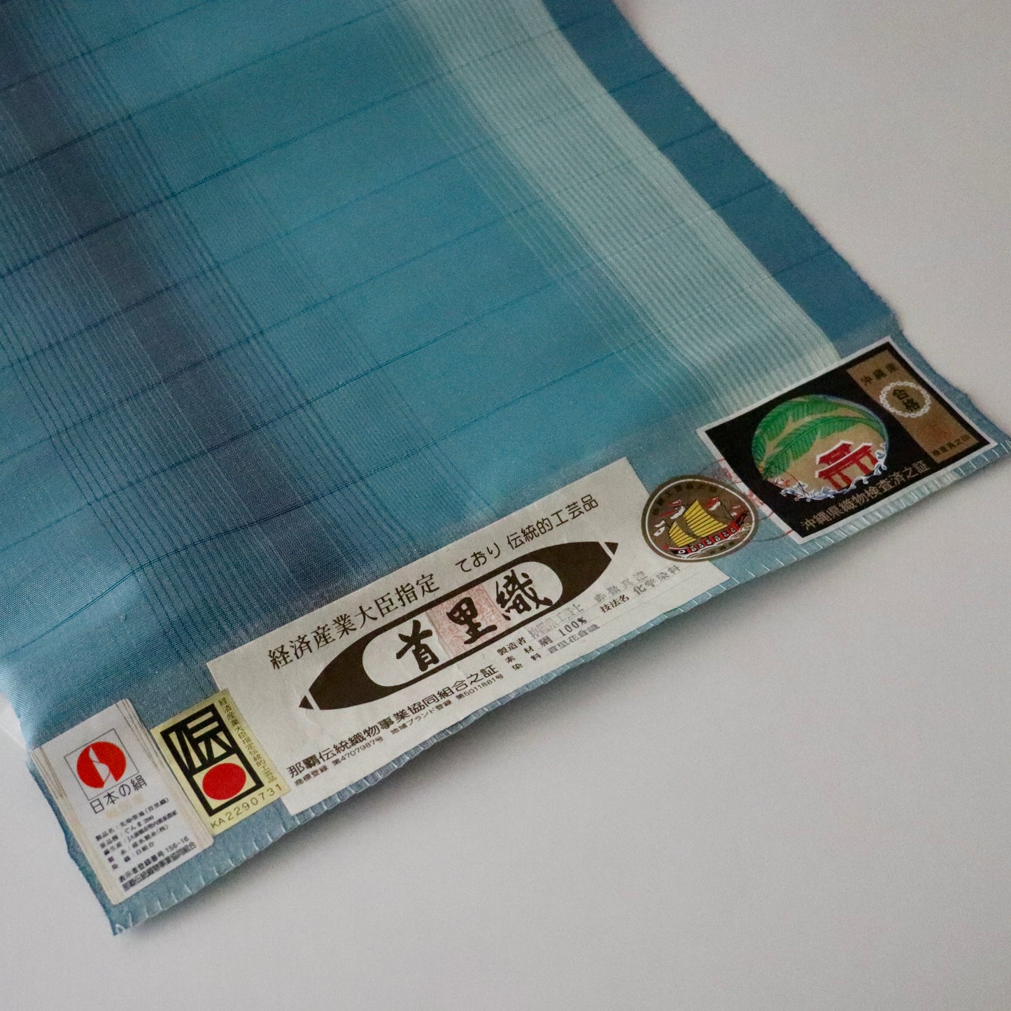 九寸名古屋帯「首里花倉織 - 碧縞」赤嶺真澄