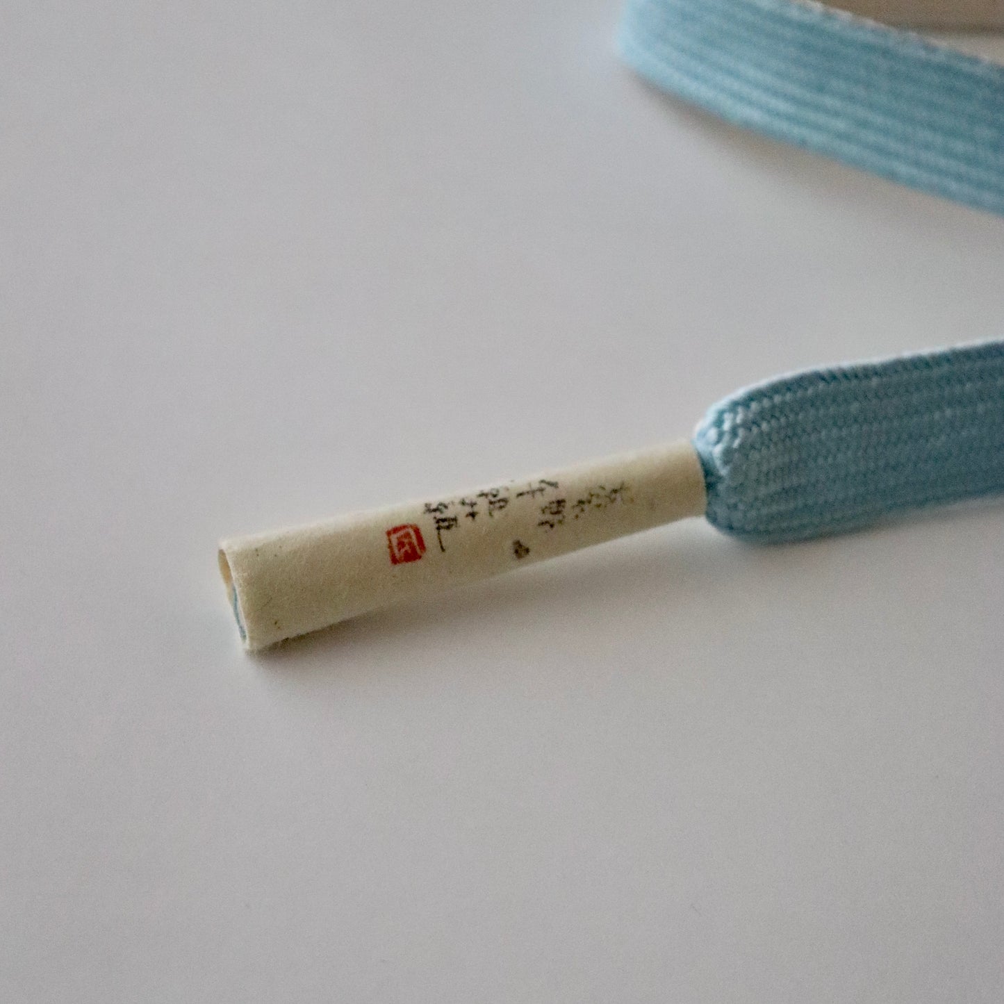 帯締め「高麗組 - 桜に花びら sky」大原商店