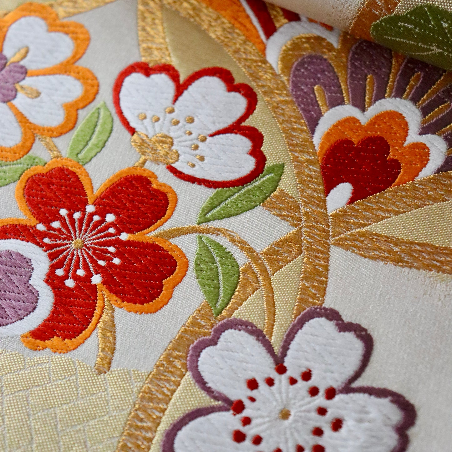 袋帯「輪繋華文」岡文織物