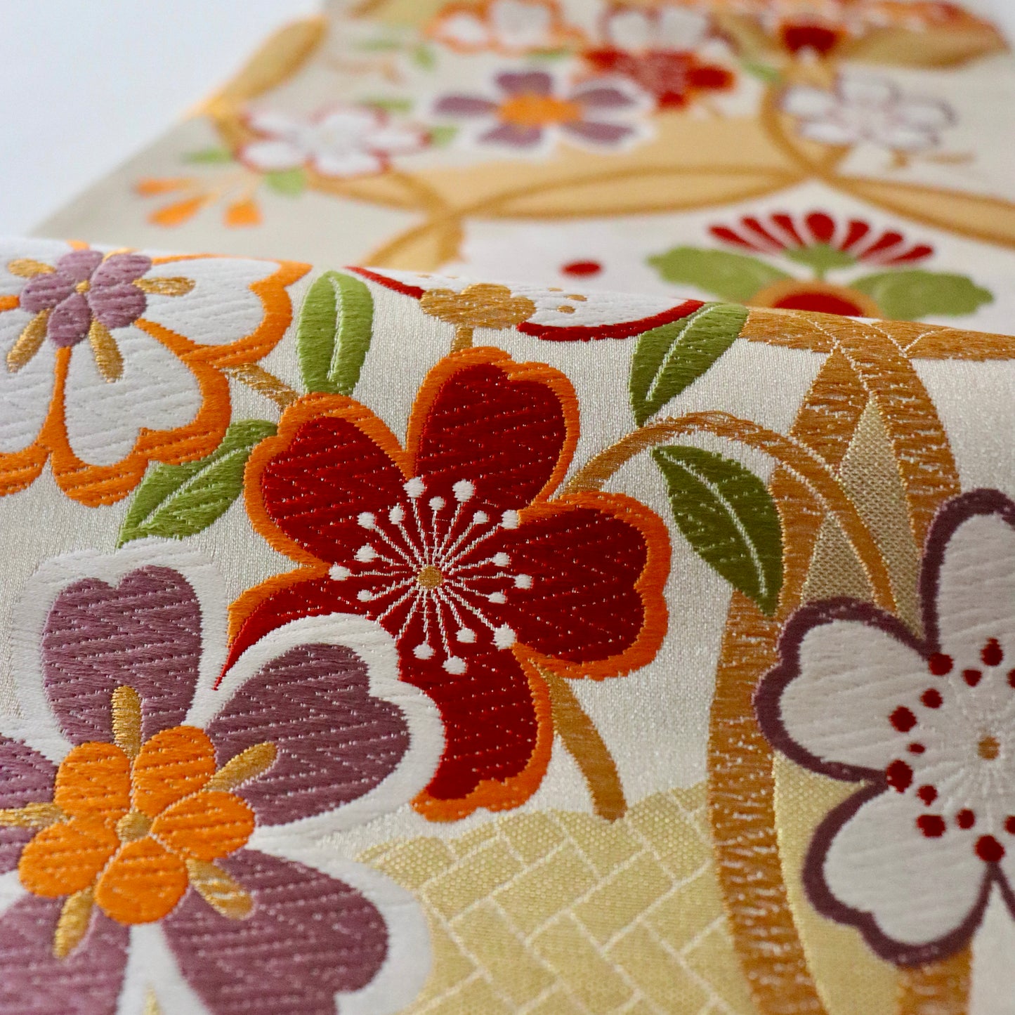 袋帯「輪繋華文」岡文織物