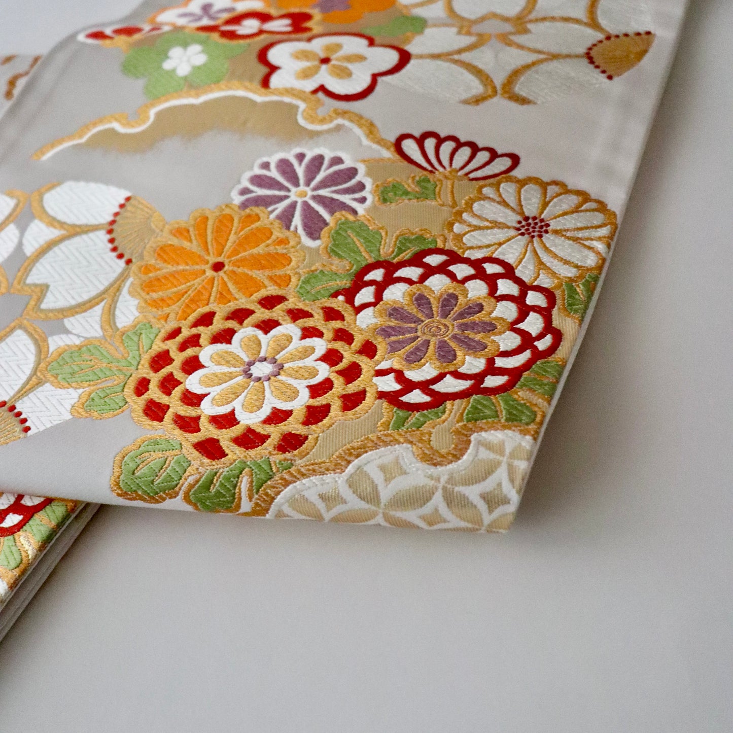 袋帯「花丸文に雪輪」岡文織物