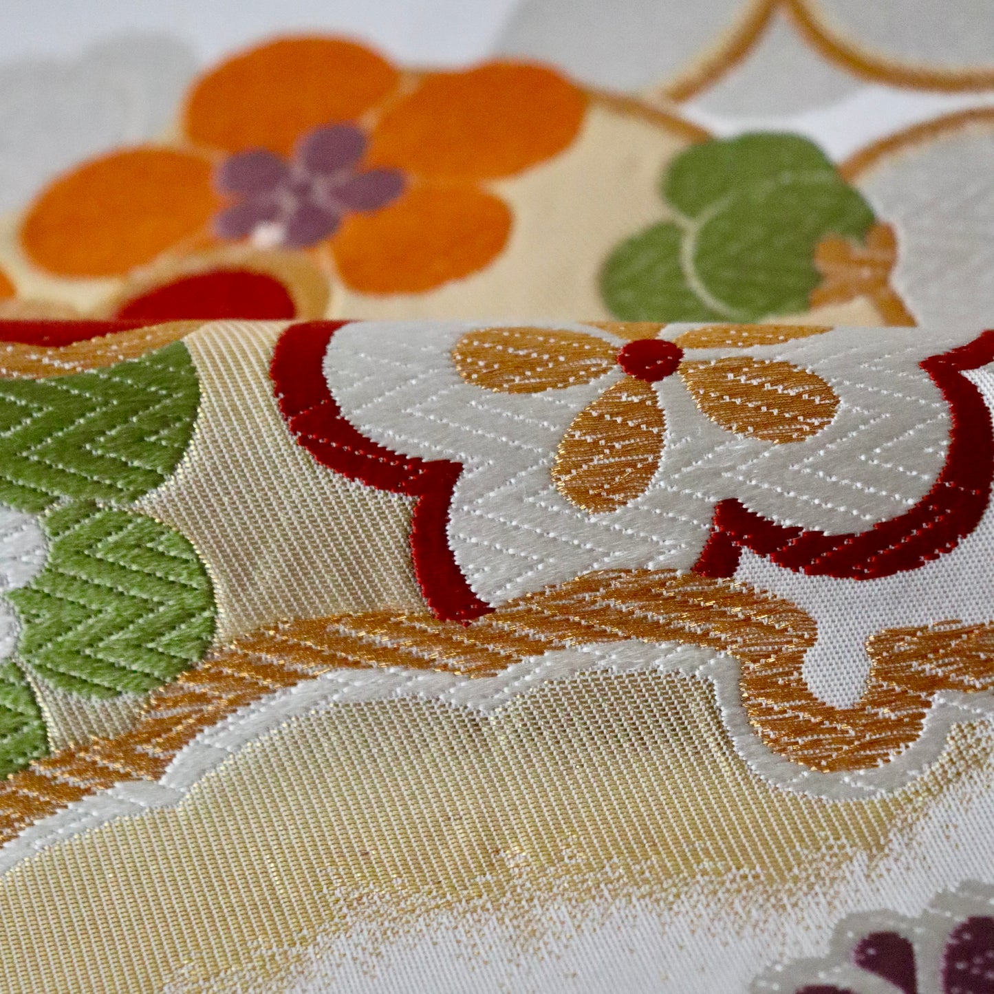 袋帯「花丸文に雪輪」岡文織物