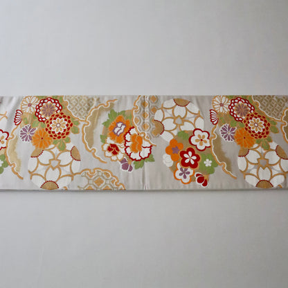 袋帯「花丸文に雪輪」岡文織物