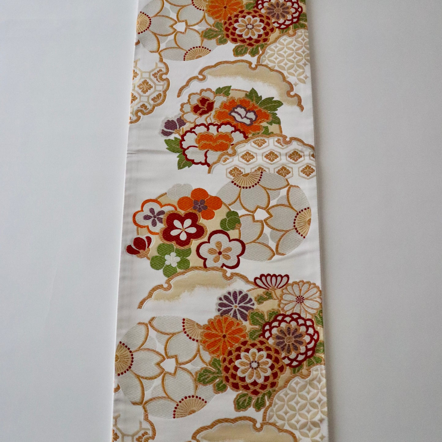 袋帯「花丸文に雪輪」岡文織物