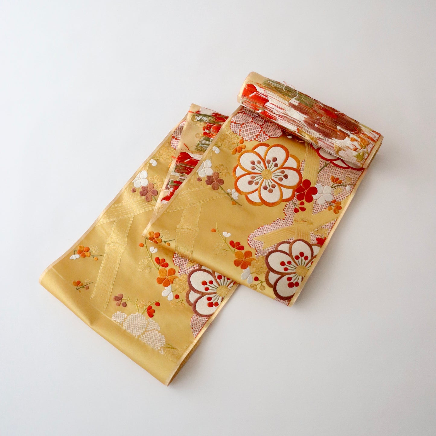 袋帯「竹垣梅花文」梅垣織物