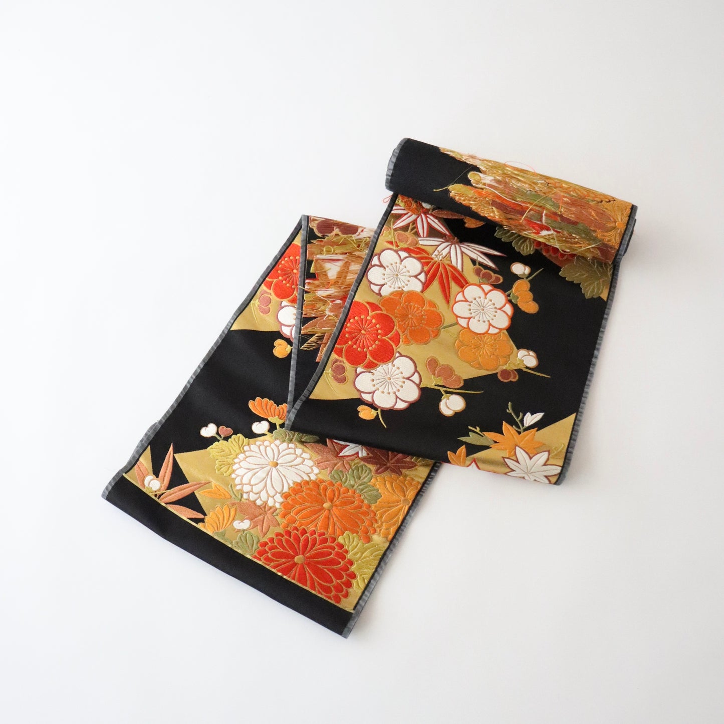 袋帯「裂形春秋花文」梅垣織物