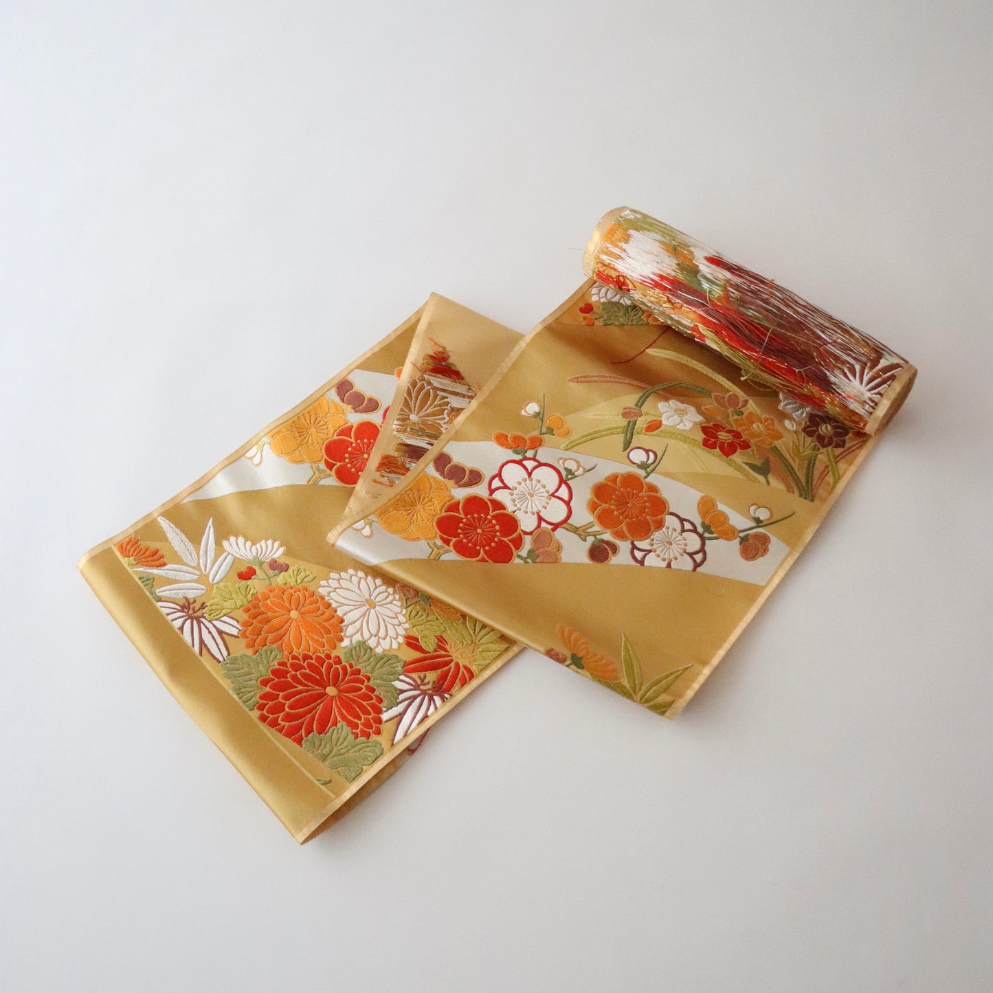 袋帯「斜取春秋花文」梅垣織物