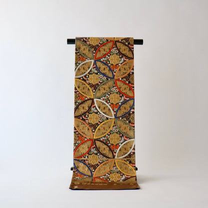 袋帯「彩七宝寿蝶華文」河合美術織物