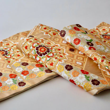 袋帯「裂形名錦寿宝文」河合美術織物