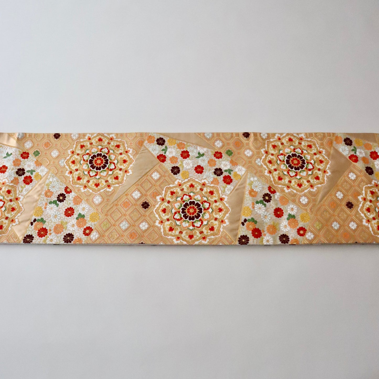 袋帯「裂形名錦寿宝文」河合美術織物