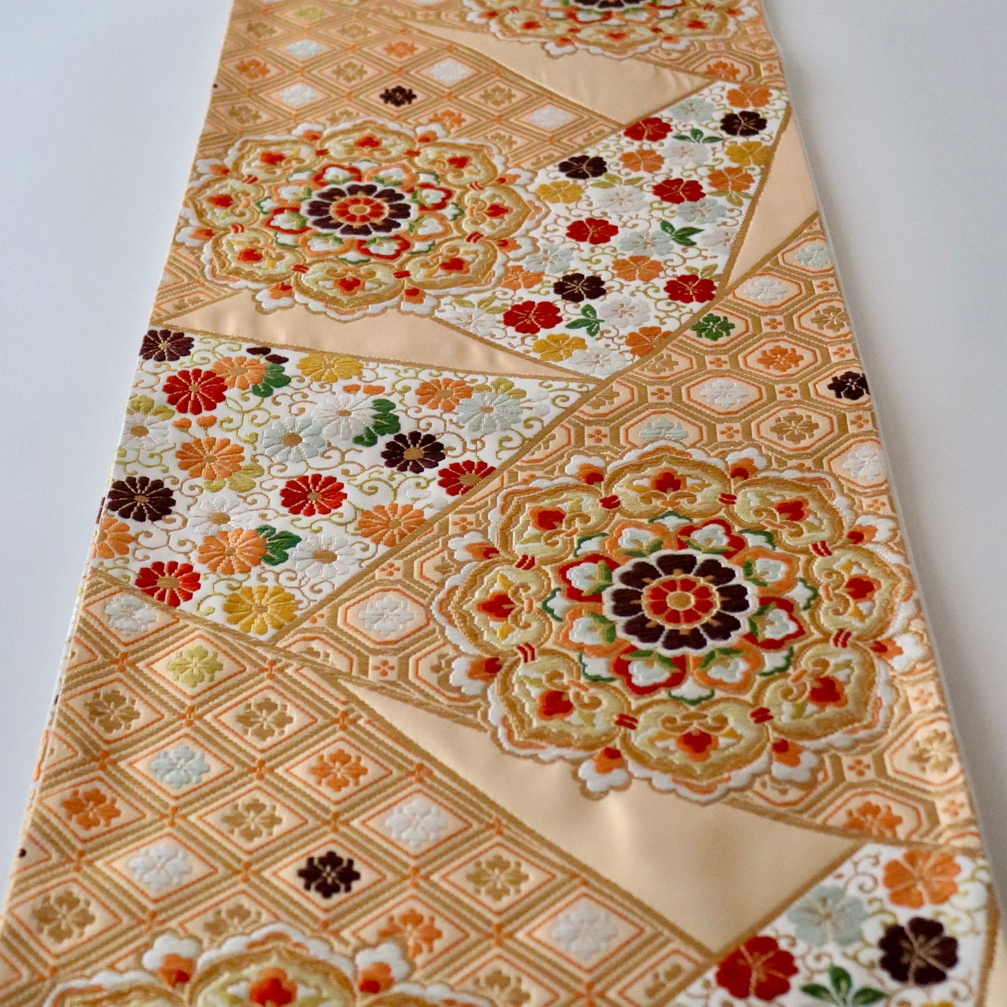 袋帯「裂形名錦寿宝文」河合美術織物