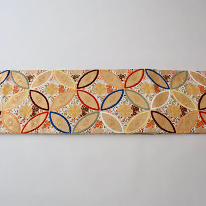 袋帯「彩七宝寿蝶華文」河合美術織物