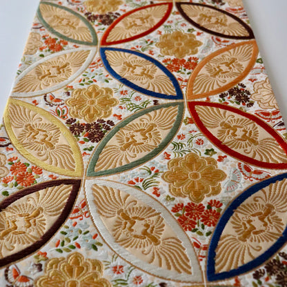 袋帯「彩七宝寿蝶華文」河合美術織物