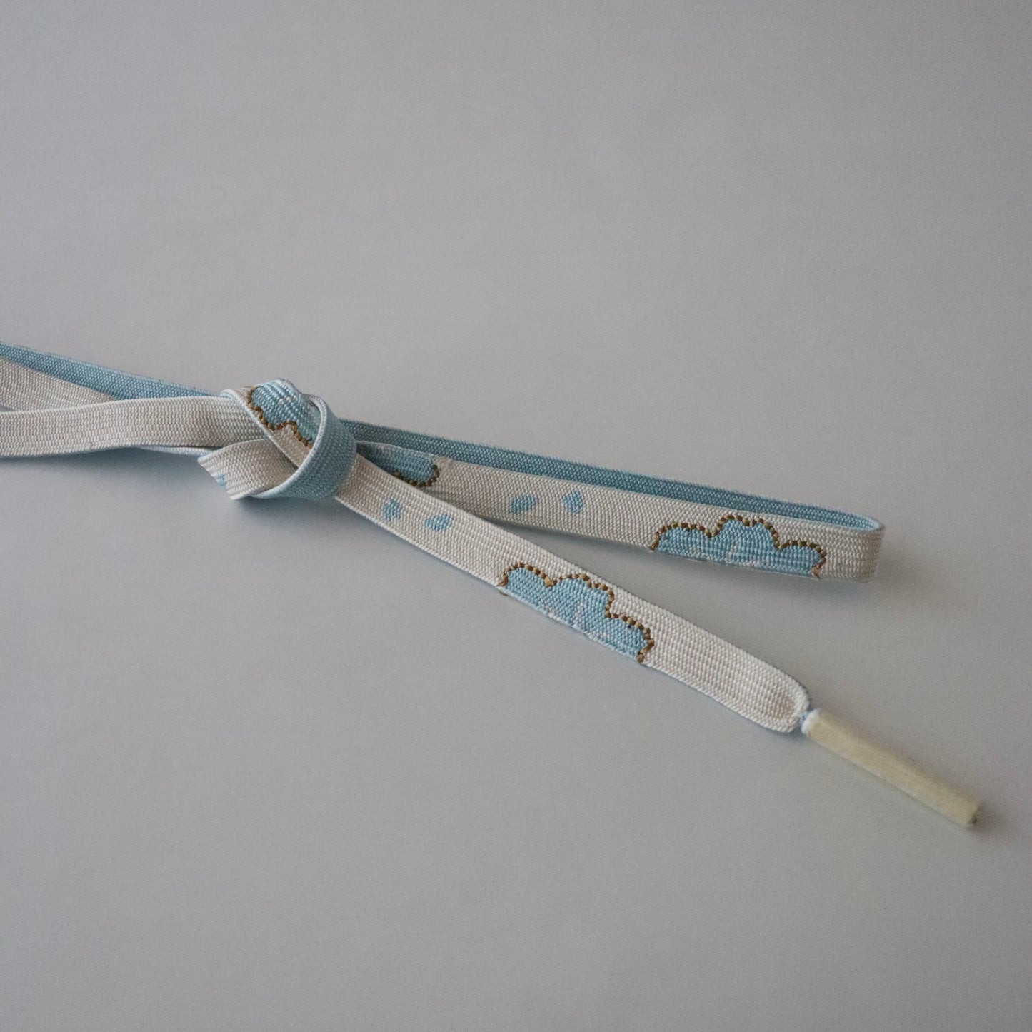 帯締め「高麗組 - 桜に花びら sky」大原商店