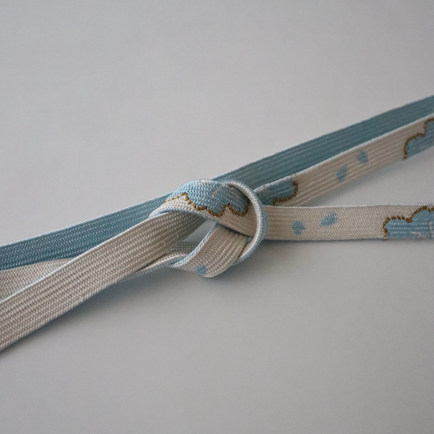 帯締め「高麗組 - 桜に花びら sky」大原商店