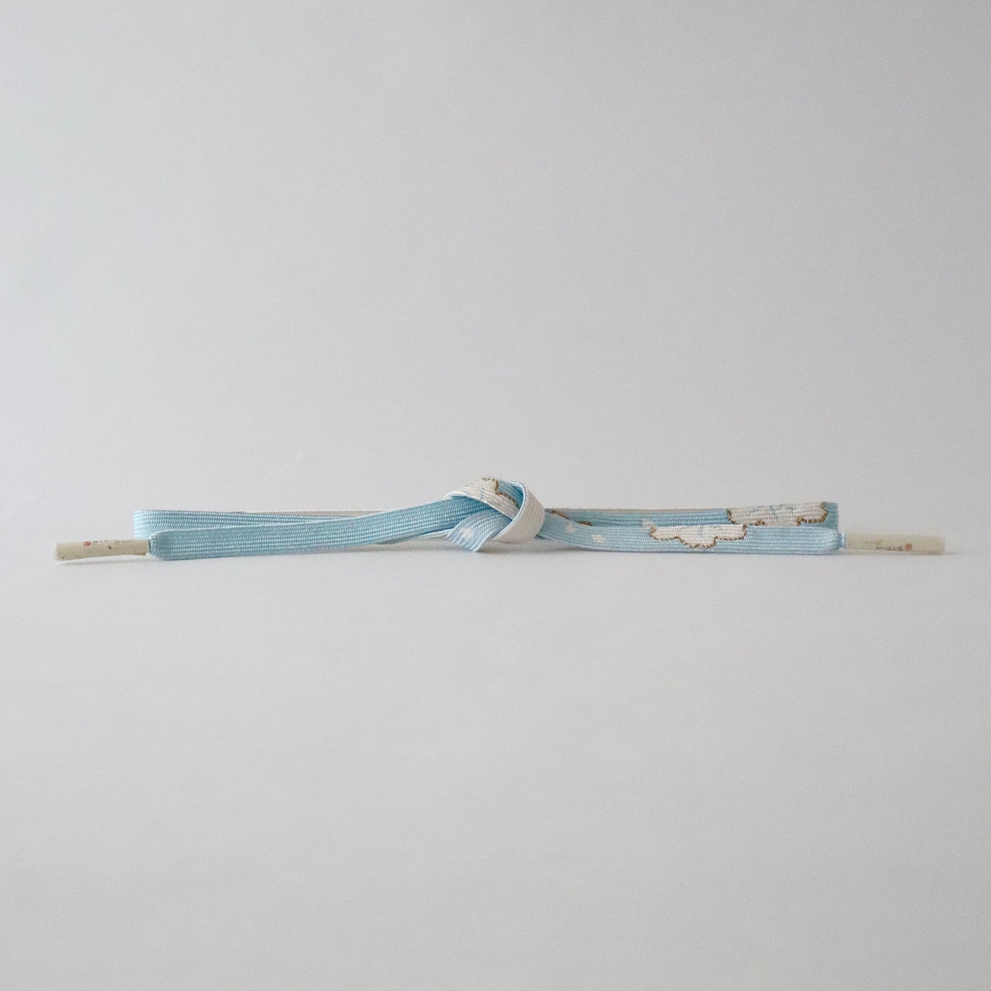 帯締め「高麗組 - 桜に花びら sky」大原商店