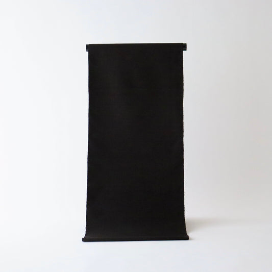 本場 久米島紬「無地/泥染」織手：翁長ヤス